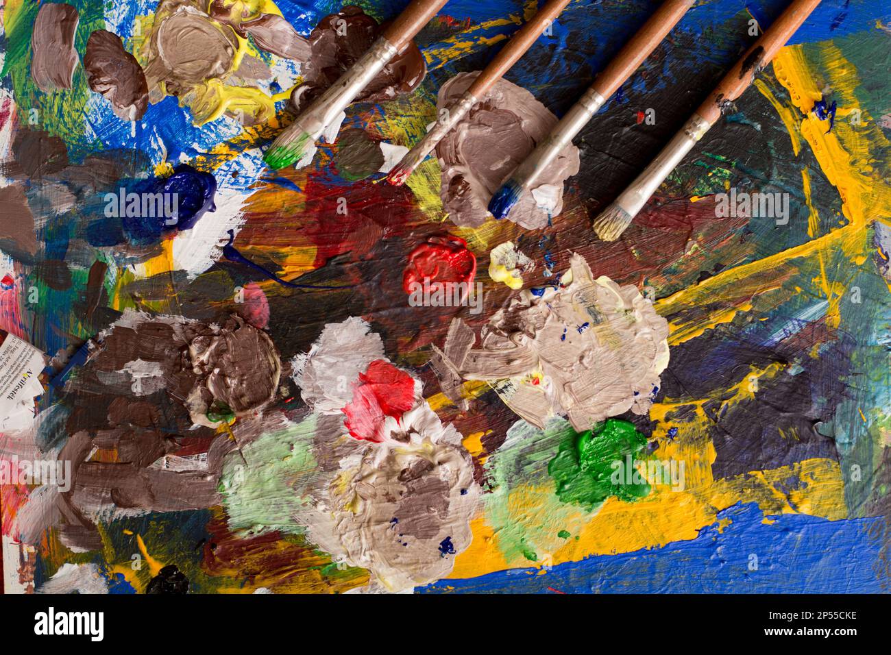Painting mixing palette art colors and brush Stock Photo - Alamy