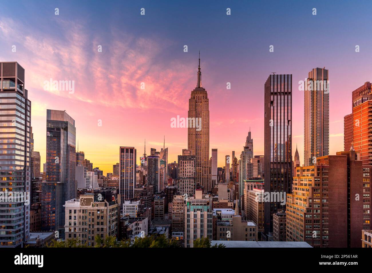 New York, USA - April 23, 2022: New York skyline at the end of sunset with Empire State Building in foreground Stock Photo