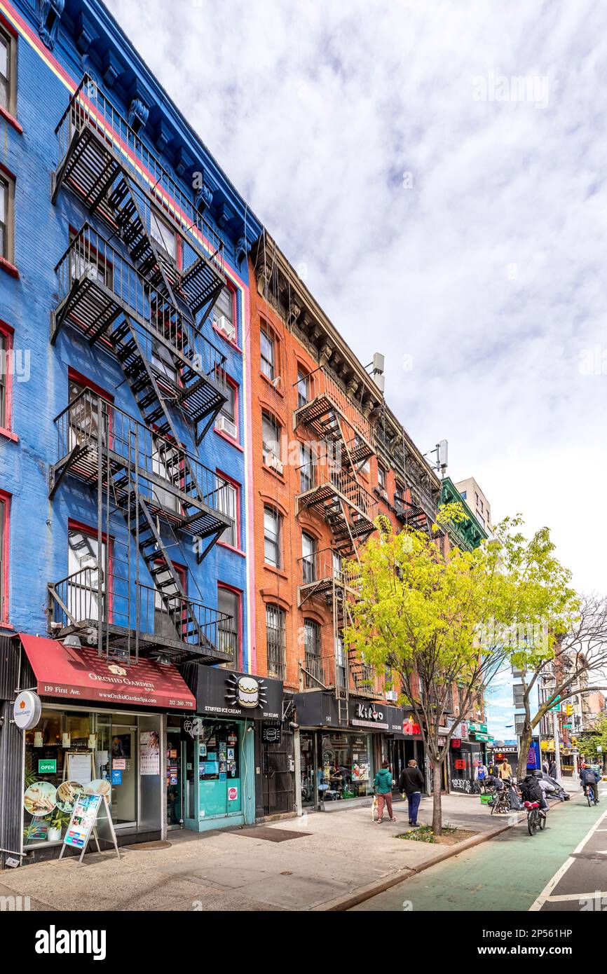New York, USA - April 23, 2022: Typical New York City building with fire escape ladders Stock Photo