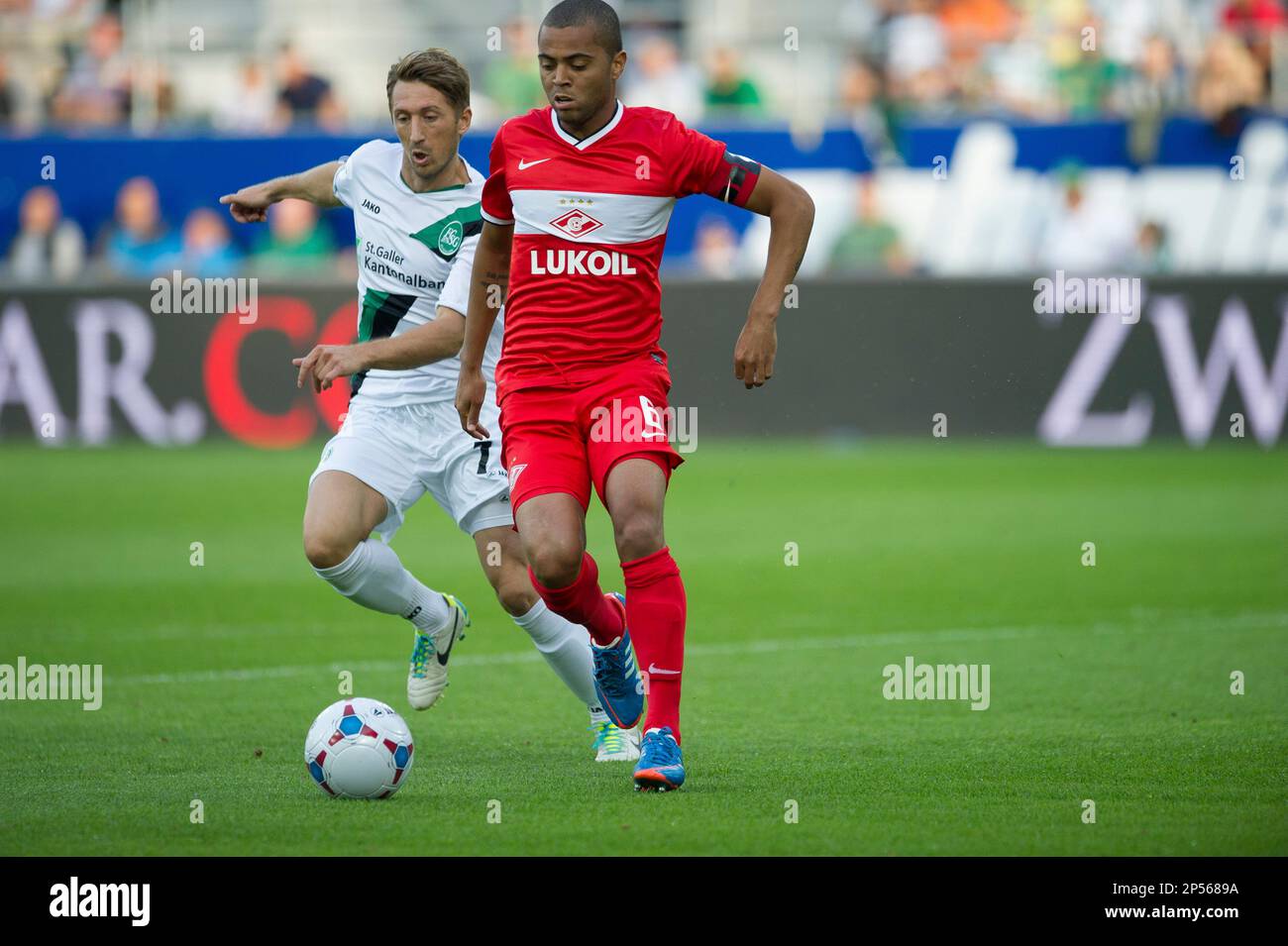 St. Gallen's Kristian Nushi, left, fights for the ball with Spartak's  Rafael de Souza Pereira during their Europa League play-offs first leg  match between FC St. Gallen and Russia's Spartak Moscow at