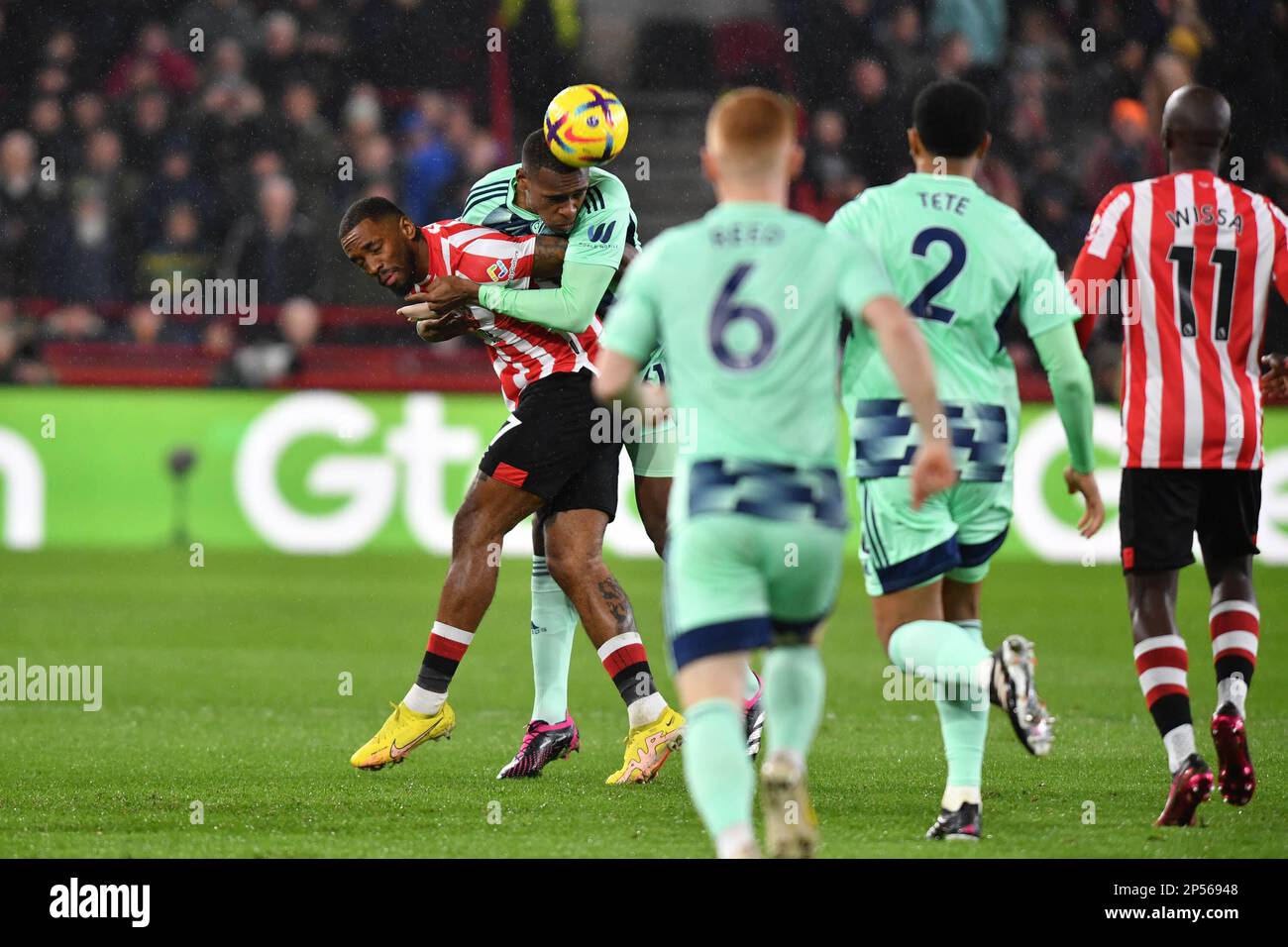 London, UK. 06th Mar, 2023. Ivan Toney of Brentford FC is smothered as he tries to reach the ball during the Premier League match between Brentford and Fulham at Gtech Community Stadium, London, England on 6 March 2023. Photo by Phil Hutchinson. Editorial use only, license required for commercial use. No use in betting, games or a single club/league/player publications. Credit: UK Sports Pics Ltd/Alamy Live News Stock Photo