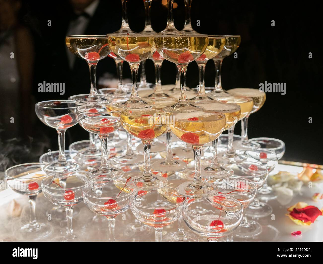 Champagne glasses standing in a tower at the wedding party. Champagne