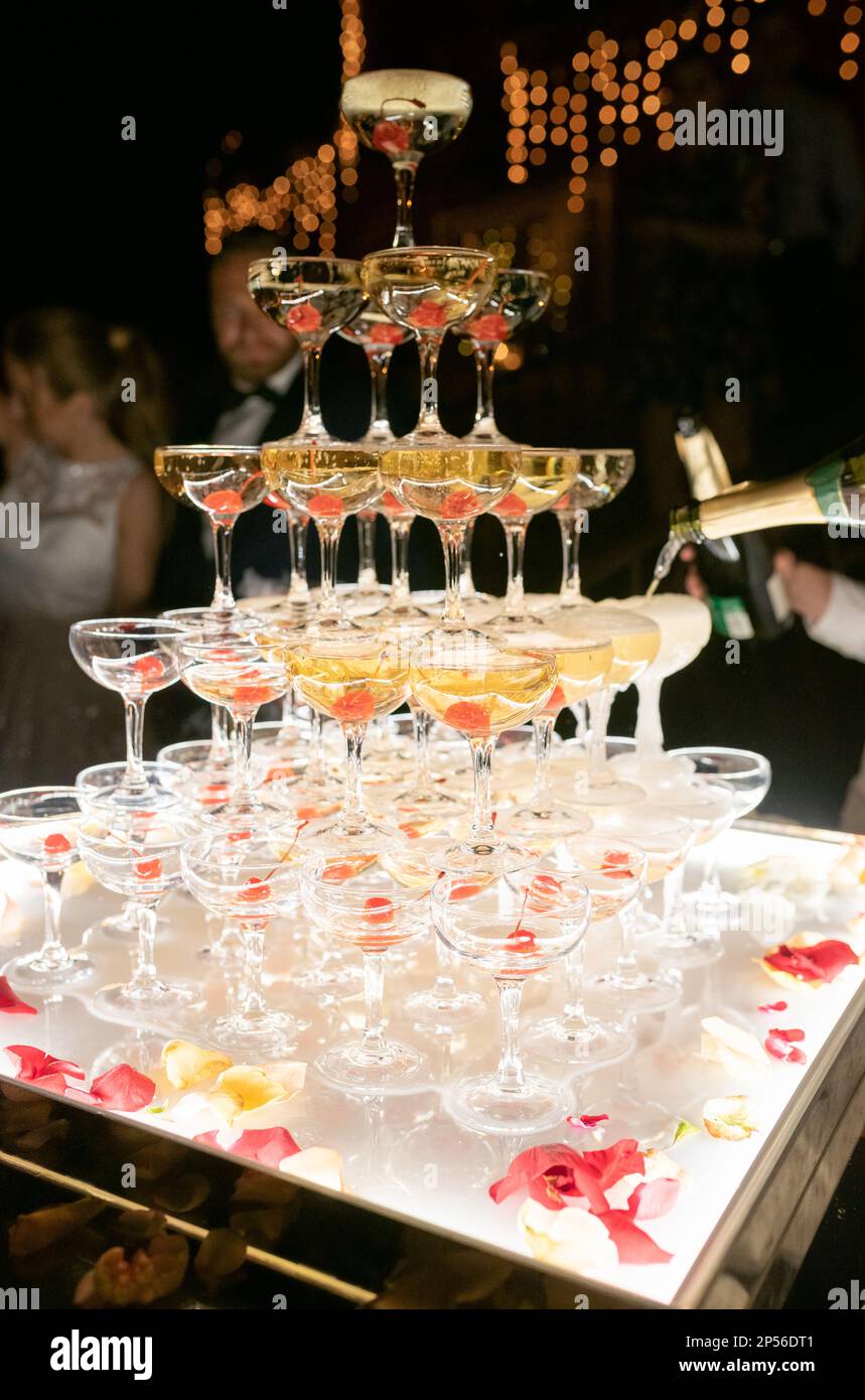 Champagne glasses standing in a tower at the wedding party. Champagne