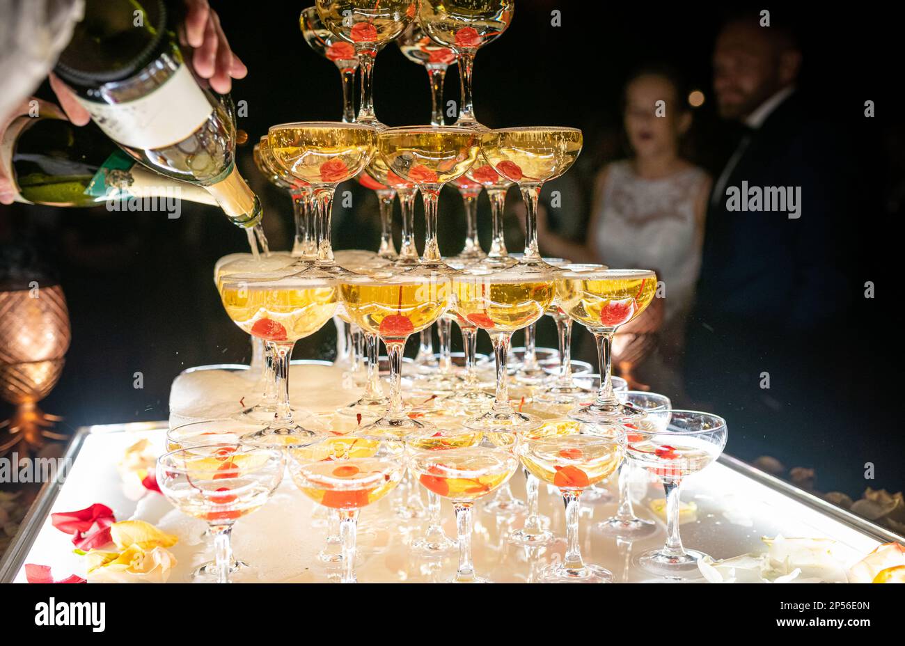 Champagne glasses standing in a tower at the wedding party. Champagne