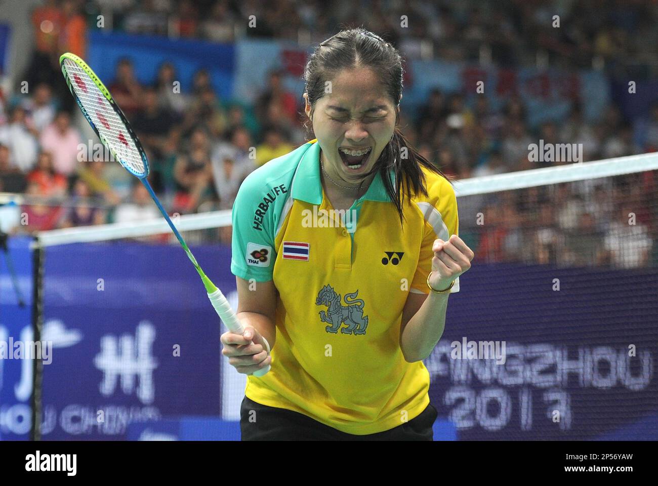Ratchanok Intanon of Thailand celebrates after winning the womens singles final against Li Xuerui of China at the 2013 BWF Badminton World Championships in Guangzhou in south Chinas Guangdong province on Sunday,