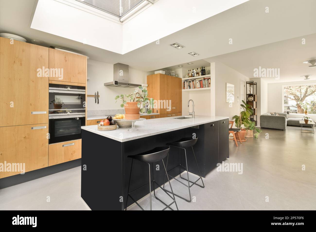 Amsterdam, Netherlands 10 April, 2021 a modern kitchen with black and white counters, wood