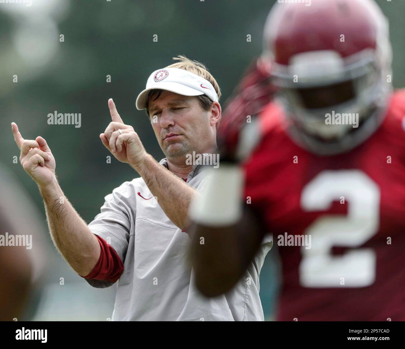 Alabama defensive coordinator/linebackers coach Kirby Smart signals to