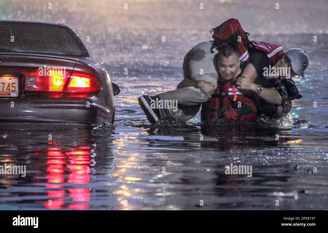Mark Summerlin of Bosque Farms is carried by firefighter Jason Paiz