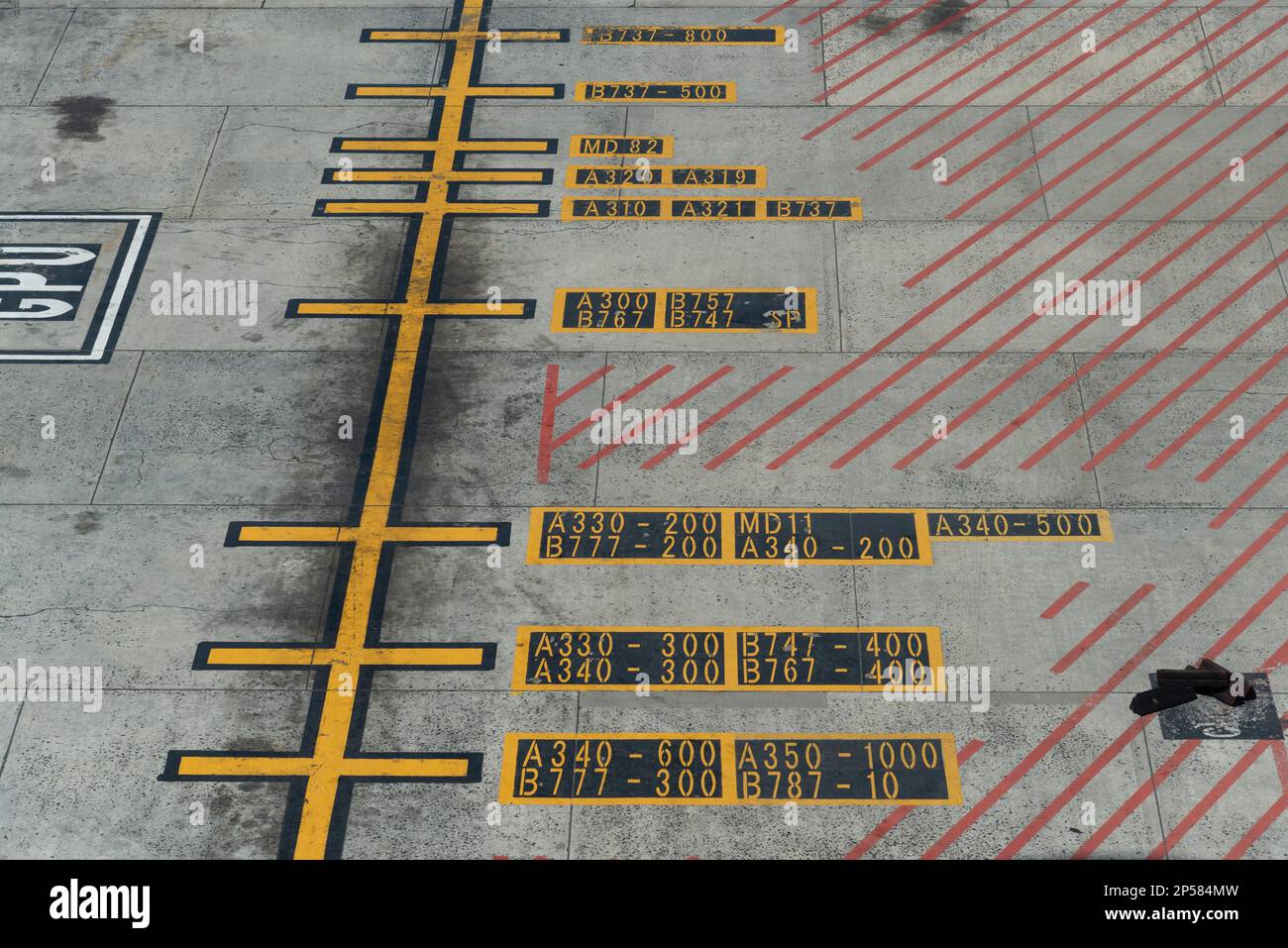 Cape Town, South Africa. 2023. Airport hatching lines with aircraft types and numbers painted on the aircraft parking zone. Stock Photo