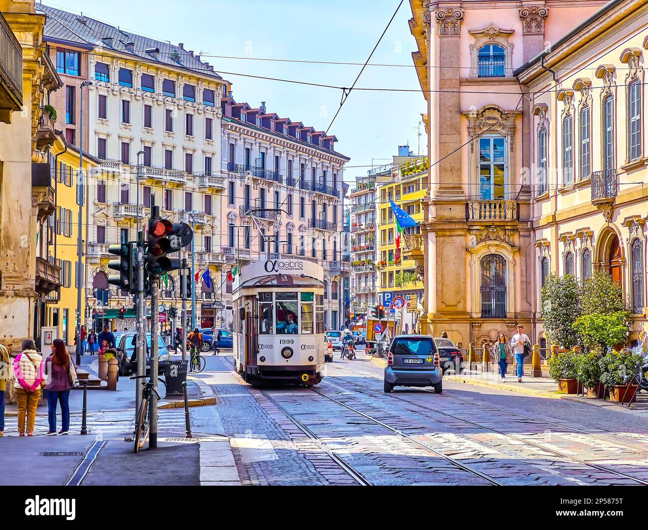 MILAN, ITALY - APRIL 11, 2022: Retro styled tram rides along Corso Magenta street in central neighborhood, on April 11 in Milan, Italy Stock Photo