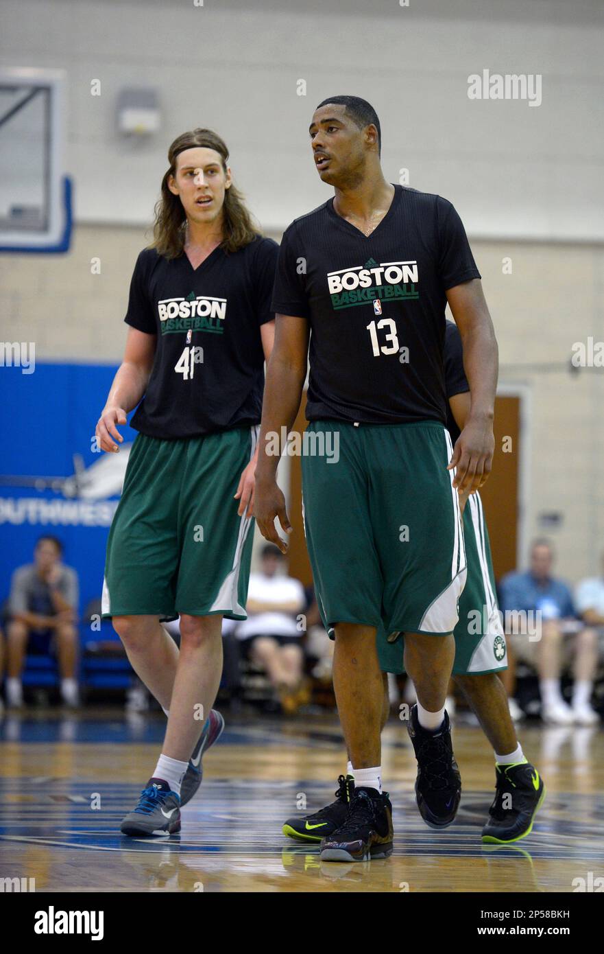 Boston Celtics center Fab Melo (13) and forward Kelly Olynyk (41) walk up  the court during an NBA summer league basketball game against the Orlando  Magic in Orlando, Fla., Sunday, July 7,, image size:881x1390