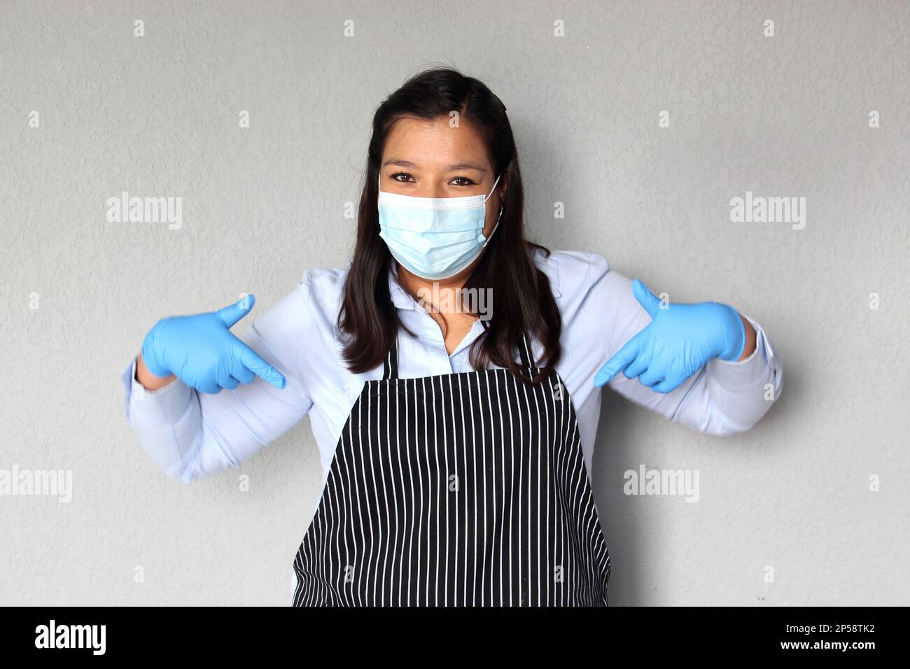 Latina waitress woman with protection mask and latex gloves working, new normality covid-19 in cafes and restaurants Stock Photo