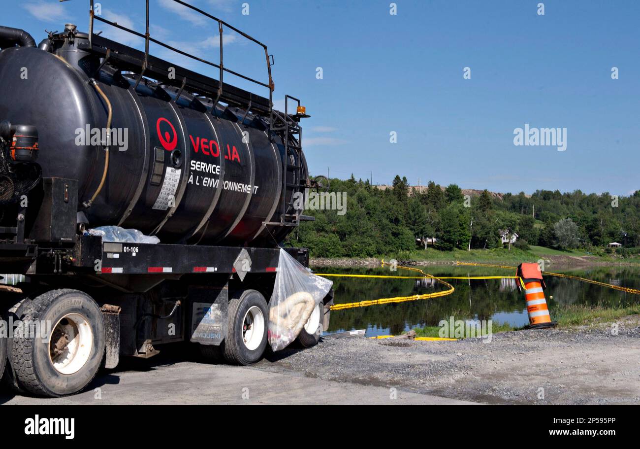 Floating barriers installed to contain an oil spill, following the