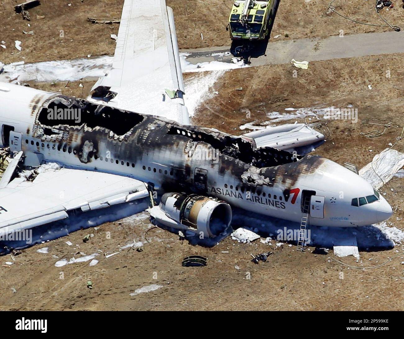 This aerial photo shows the wreckage of the Asiana Flight 214 airplane ...