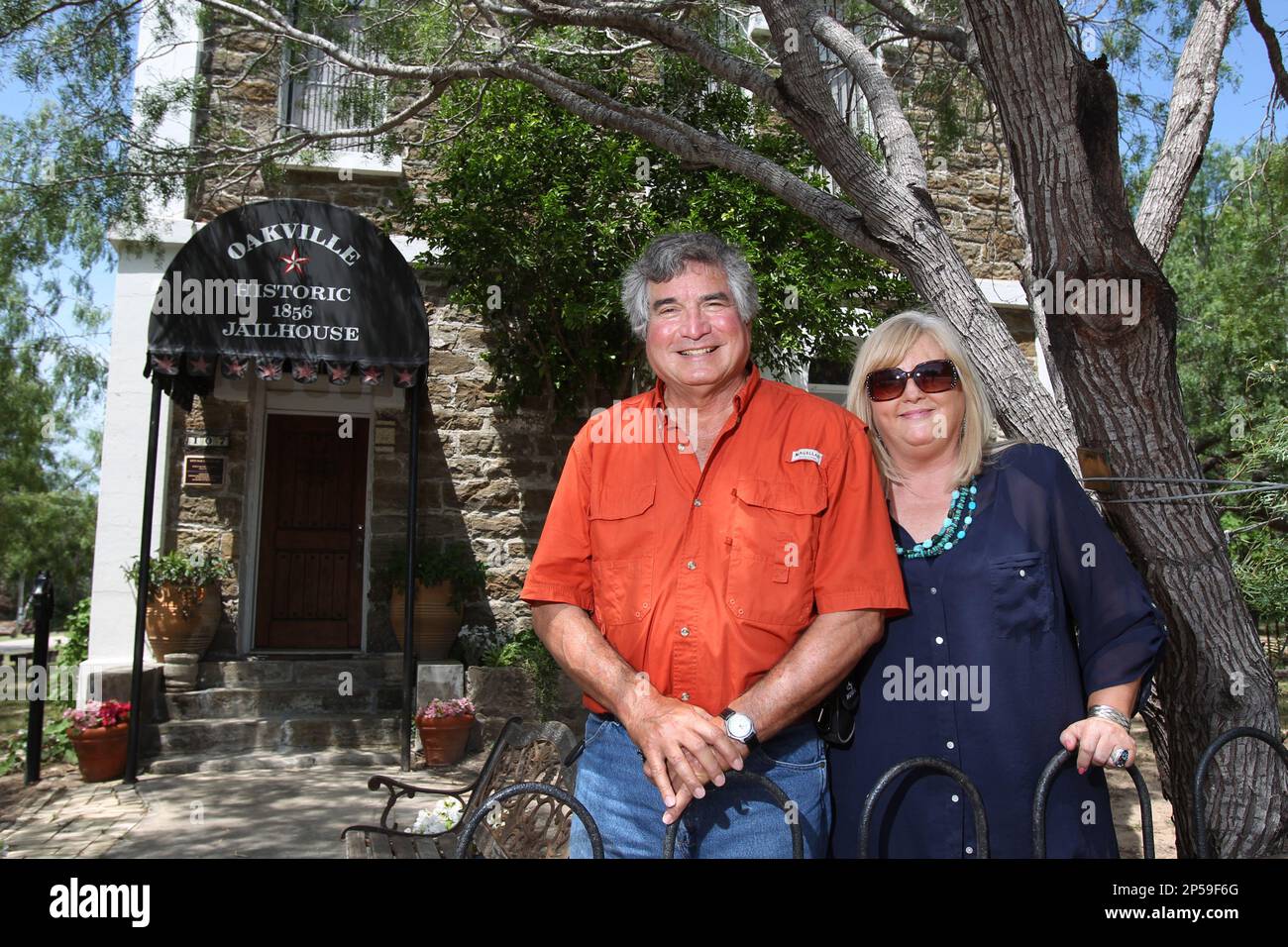 In this June 26, 2013 photo, Albert and Mari Davila stand outside the old  Oakville Jailhouse in Oakville, Texas, which they have turned into a bed  and breakfast, helping to preserve a