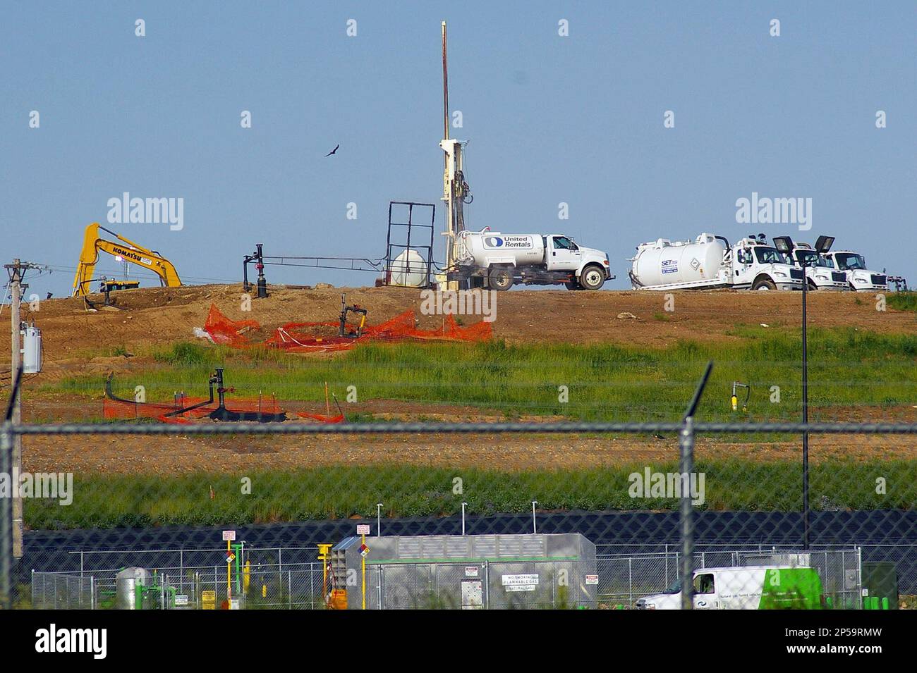 FILE In this May 22, 2013, file photo workers try to reduce odors