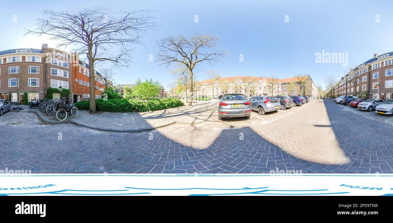 a street with cars parked on the side and buildings in the back ground ...