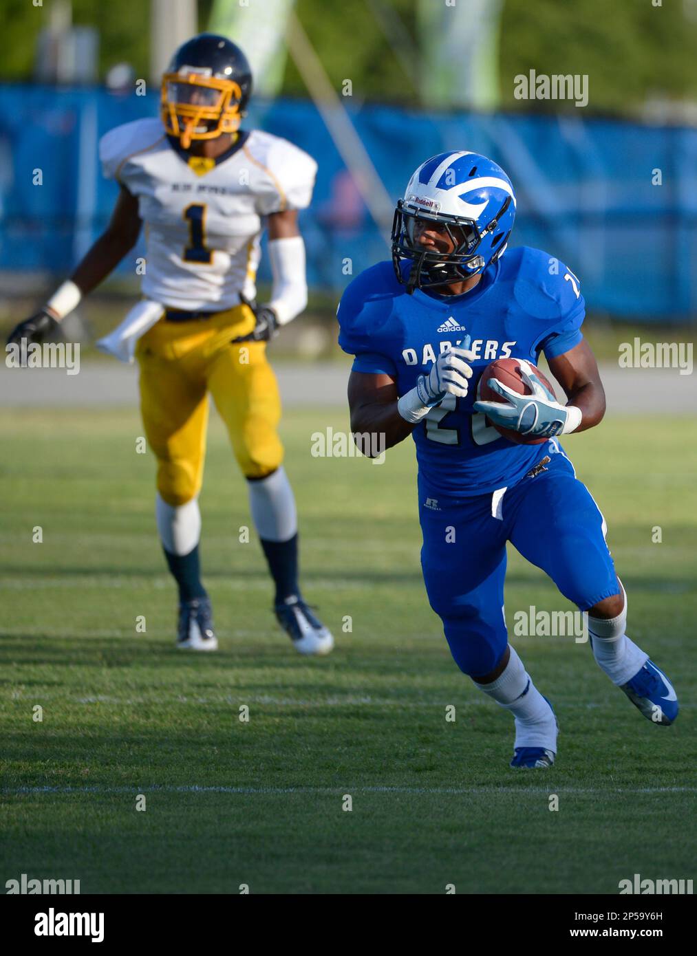 Apopka defensive back Ben (28), front, scores a touchdown after