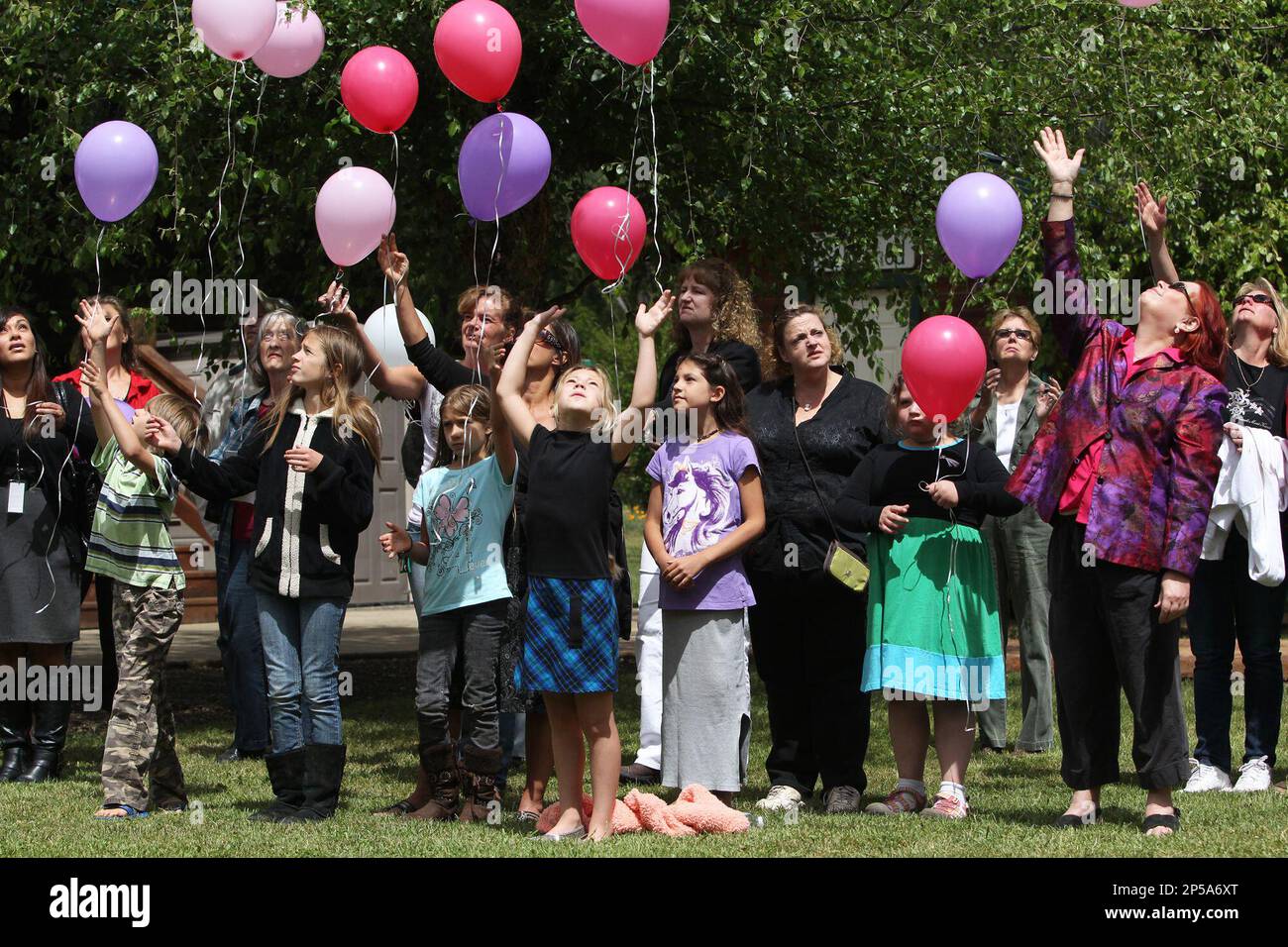 Shingletown, Calif., residents release balloons during a memorial