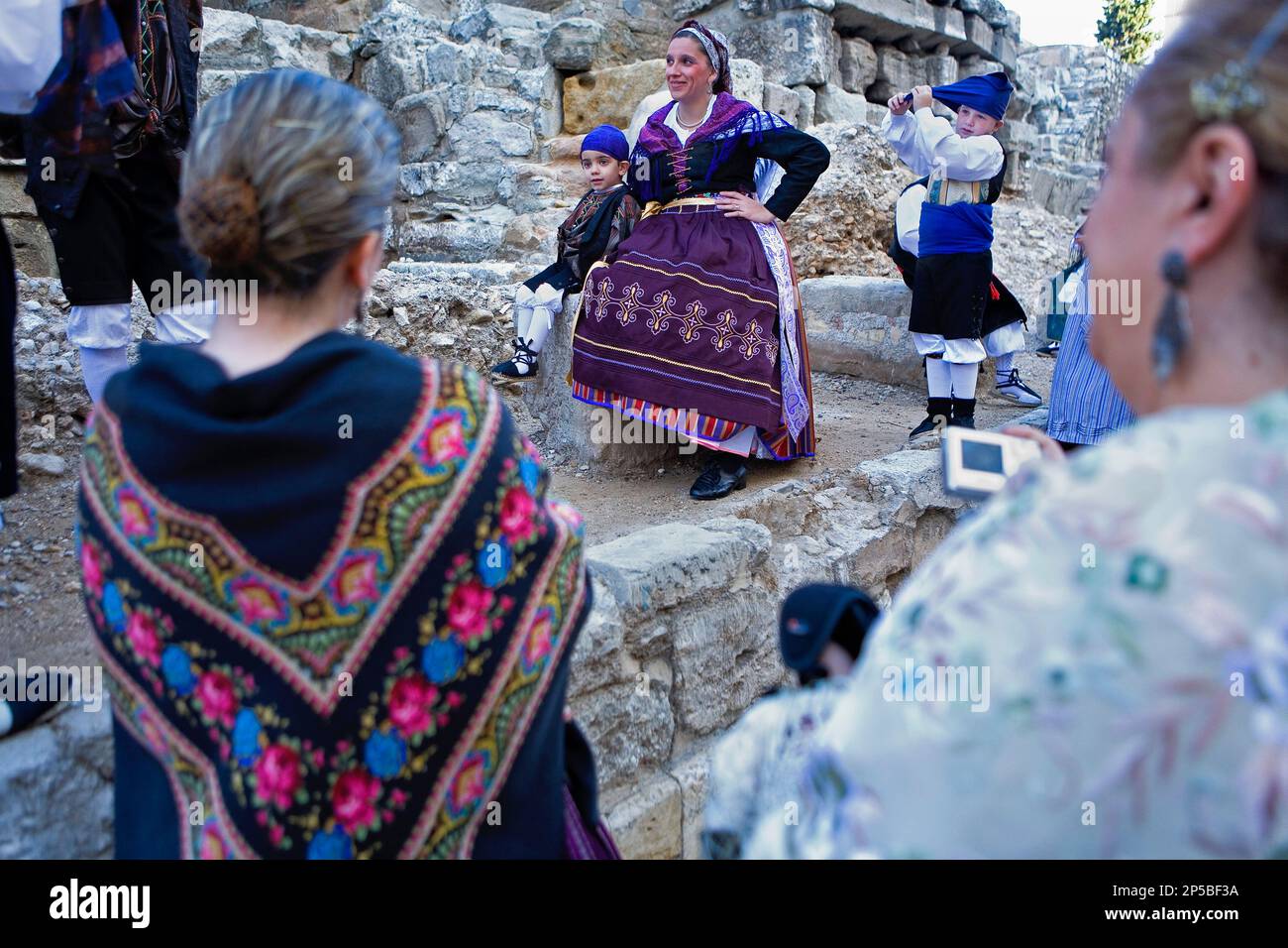 Zaragoza, Aragón, Spain: People with traditional costume on October 12 during the celebration of El Pilar in roman wall Stock Photo