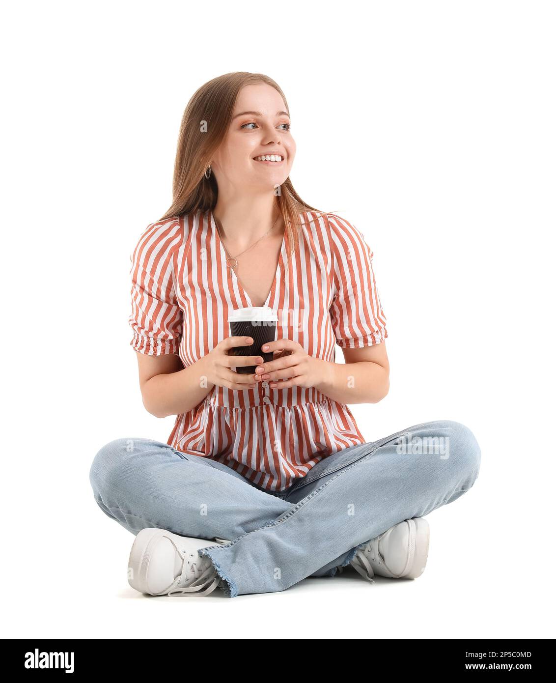 Beautiful girl with cup of coffee sitting on white background Stock ...