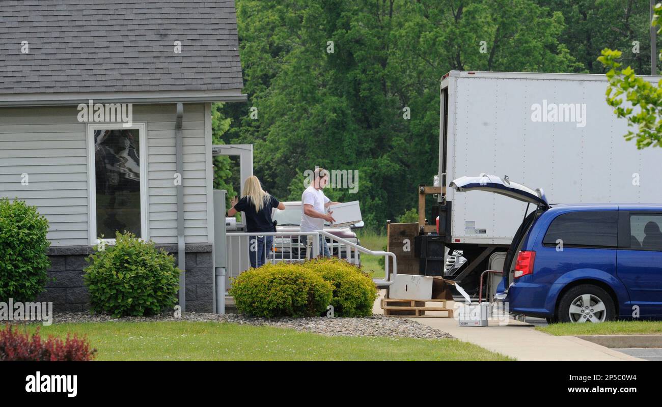 Agents remove boxes from the headquarters of Minuteman Environmental  Services along Housels Run Road at the Milton Industrial Park, Milton, Pa.,  Wednesday, May 29, 2013, after the company was raided by the