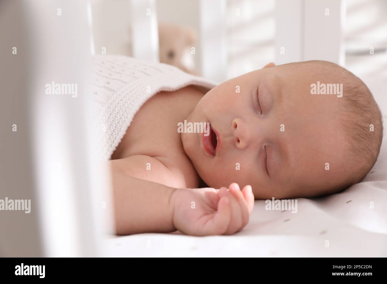 Cute little baby sleeping in crib, closeup Stock Photo Alamy