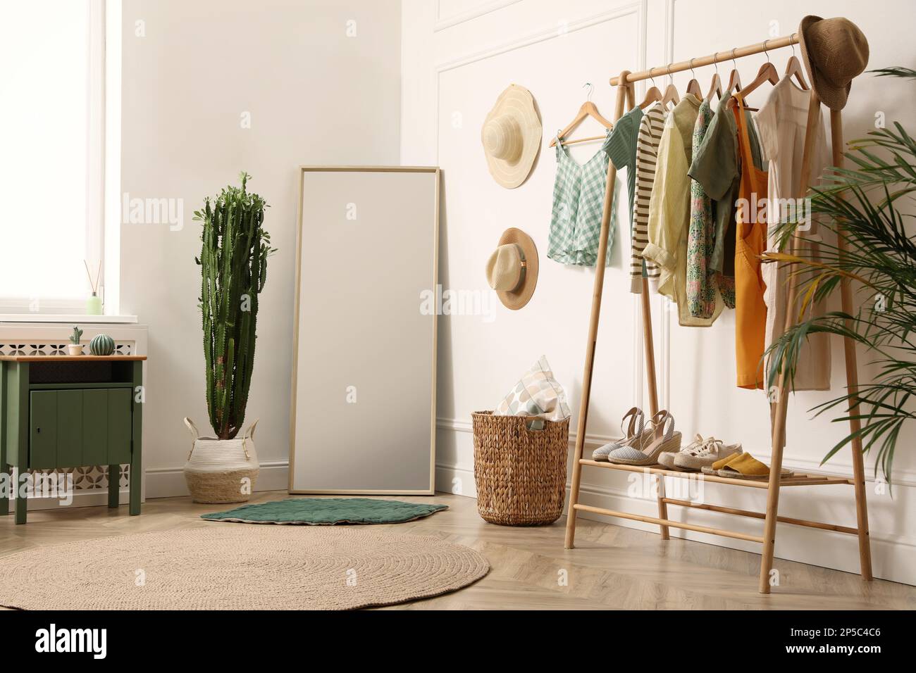 Modern room with clothes rack and big mirror. Interior design Stock ...