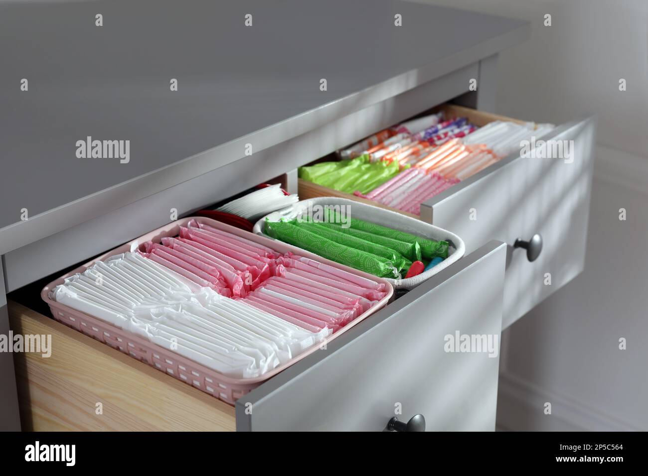 Open Cabinet Drawers With Menstrual Pads Tampons And Pantyliners 