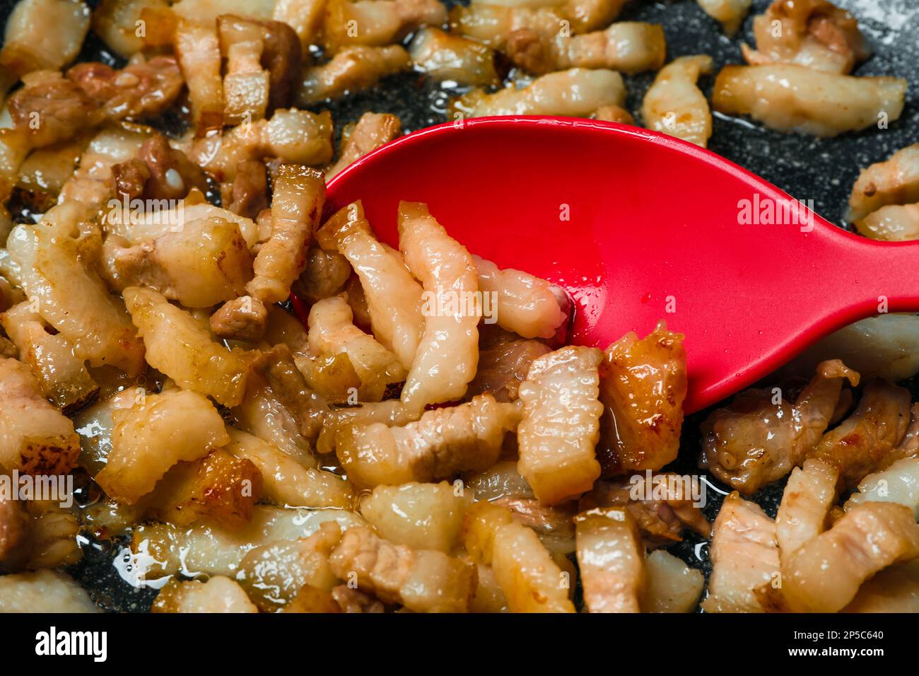 Frying cracklings in cookware, closeup. Pork lard Stock Photo Alamy