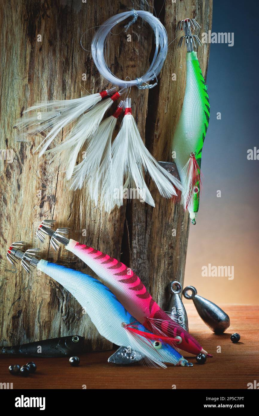 Artificial bait for fishing with hooks and sinkers on wood, for catching  fish with trolling technique Stock Photo - Alamy