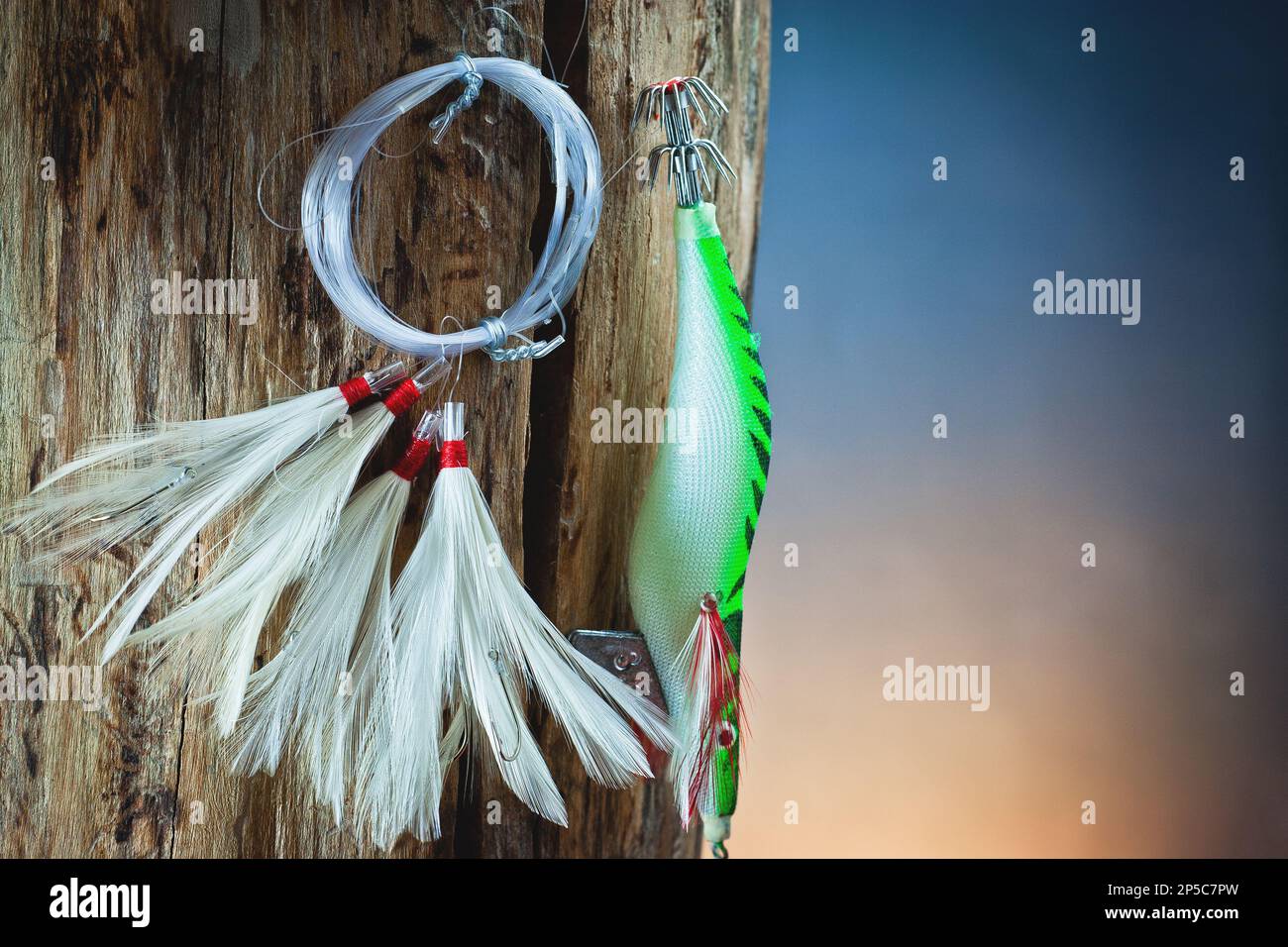 Artificial bait for fishing with hooks and sinkers on wood, for