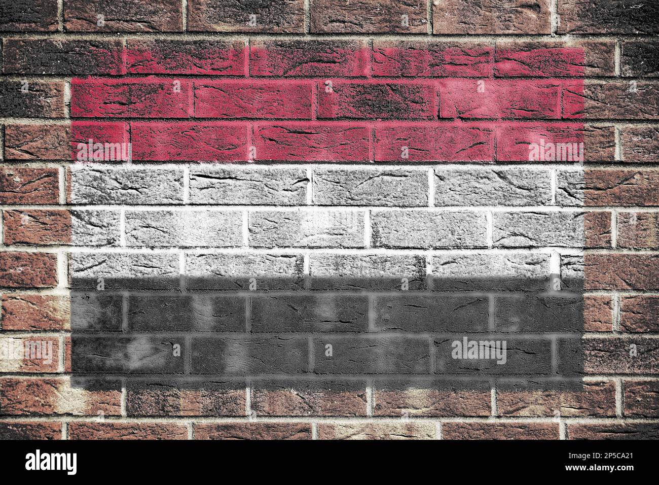 Yemen flag on old brick wall background Stock Photo - Alamy