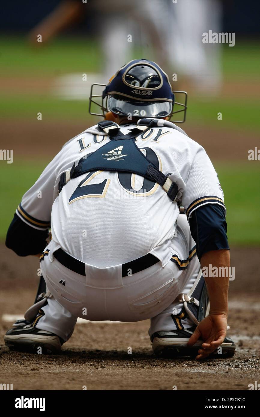 MILWAUKEE, WI - AUGUST 06: Milwaukee Brewer catcher Jonathan Lucroy signs  his retirement papers prior to a game between the Milwaukee Brewers and the  Cincinnati Reds at American Family Field on August