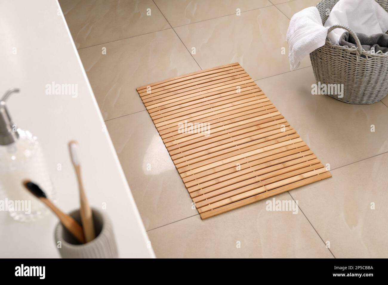Wooden mat on floor in bathroom. Interior design Stock Photo - Alamy