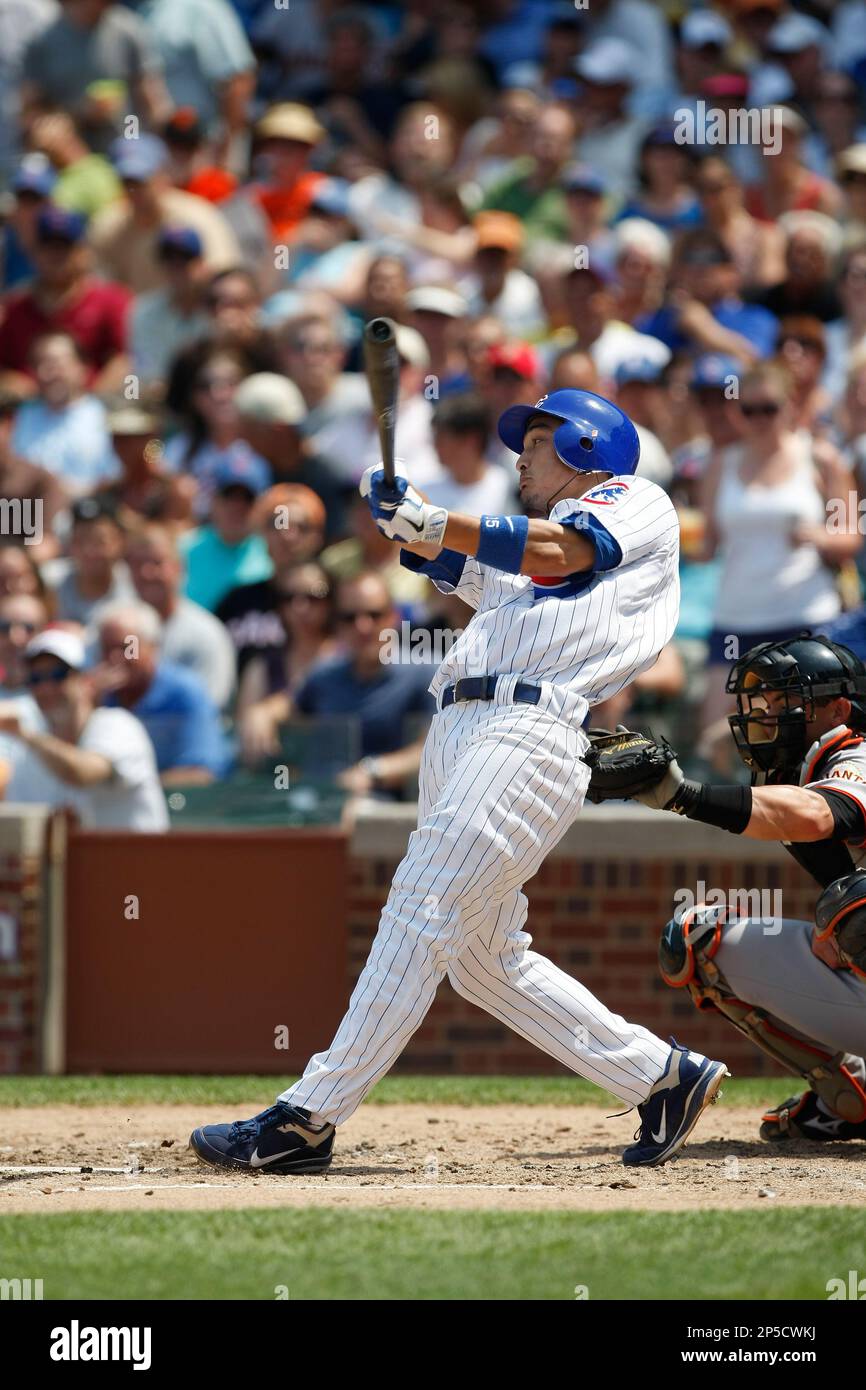 CHICAGO, IL - JUNE 30: Darwin Barney #15 of the Chicago Cubs celebrates the  victory with team mates after scoring the winning run against the San  Francisco Giants at Wrigley Field on