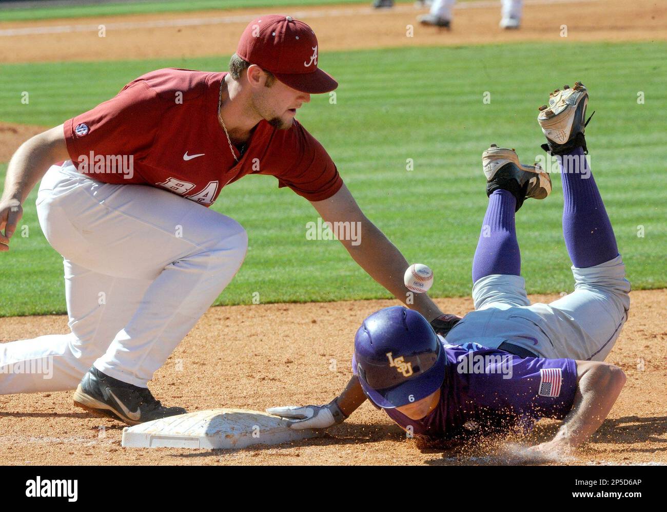 The ball gets away from Alabama's Austen Smith as he tries to pick off