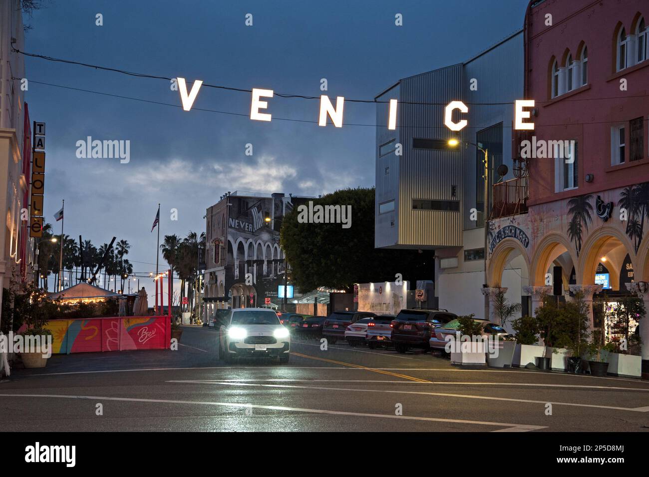 Iconic sign lit up a tight at Venice Beach, CA Stock Photo