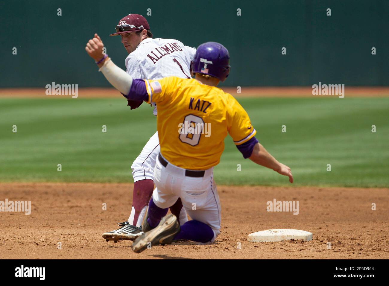 Texas A&M Aggies second baseman Blake Allemand (1) turns a double play as  LSU Tigers baserunner Mason Katz (8) slides into second base during the  NCAA Southeastern Conference baseball game on May
