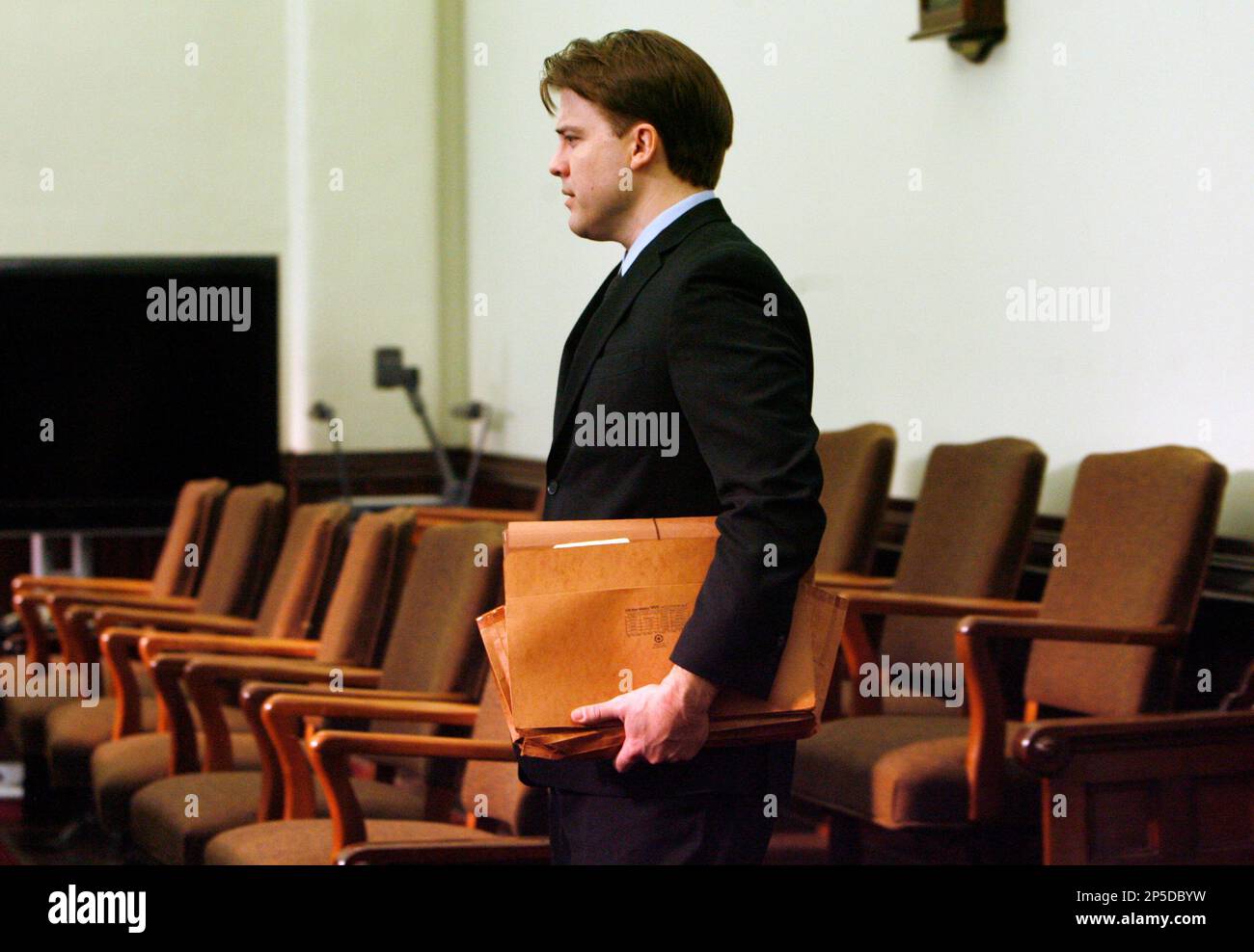 Brett Seacat enters the courtroom at the start of day one of jury