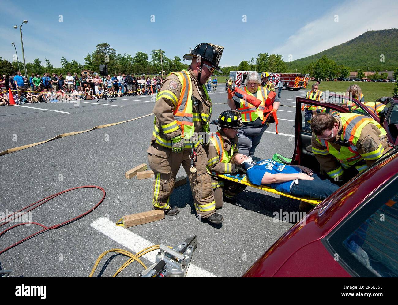 Spotswood High School students watch as firefighters and EMTs with the McGaheysville Fire
