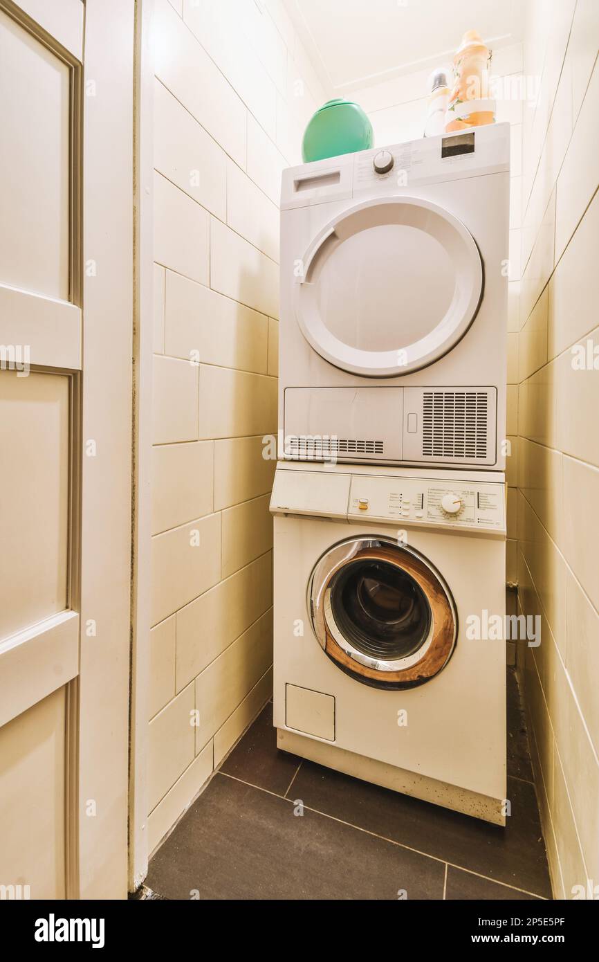 a laundry room with a washer and dryer next to the door that has been installed on the wall