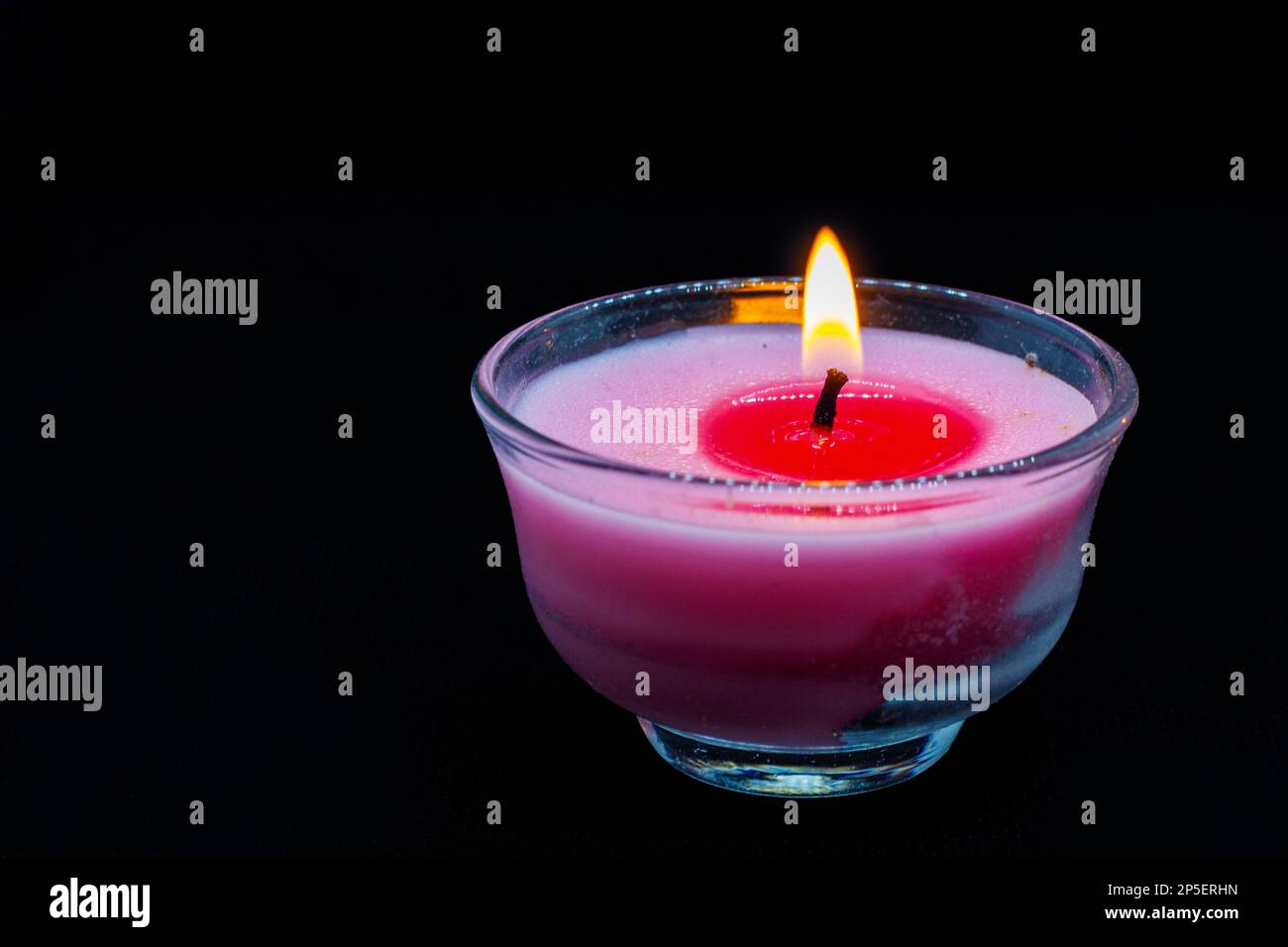 burning candle placed on black background Stock Photo Alamy