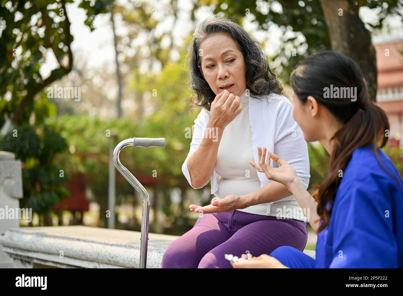 60s aged disabled asian hi-res stock photography and images - Alamy