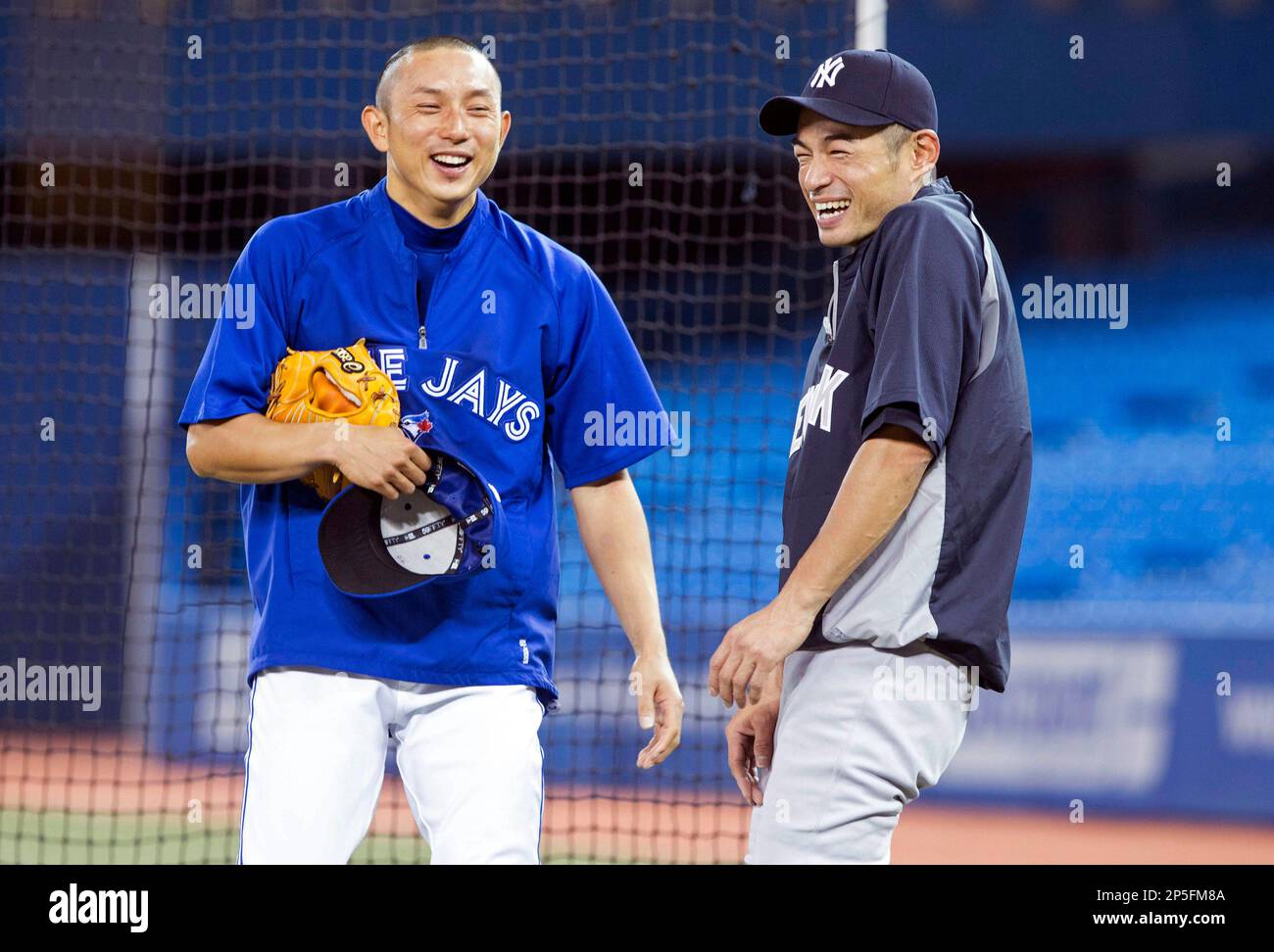 Toronto Blue Jays; Munenori Kawasaki, left, shares a joke with New