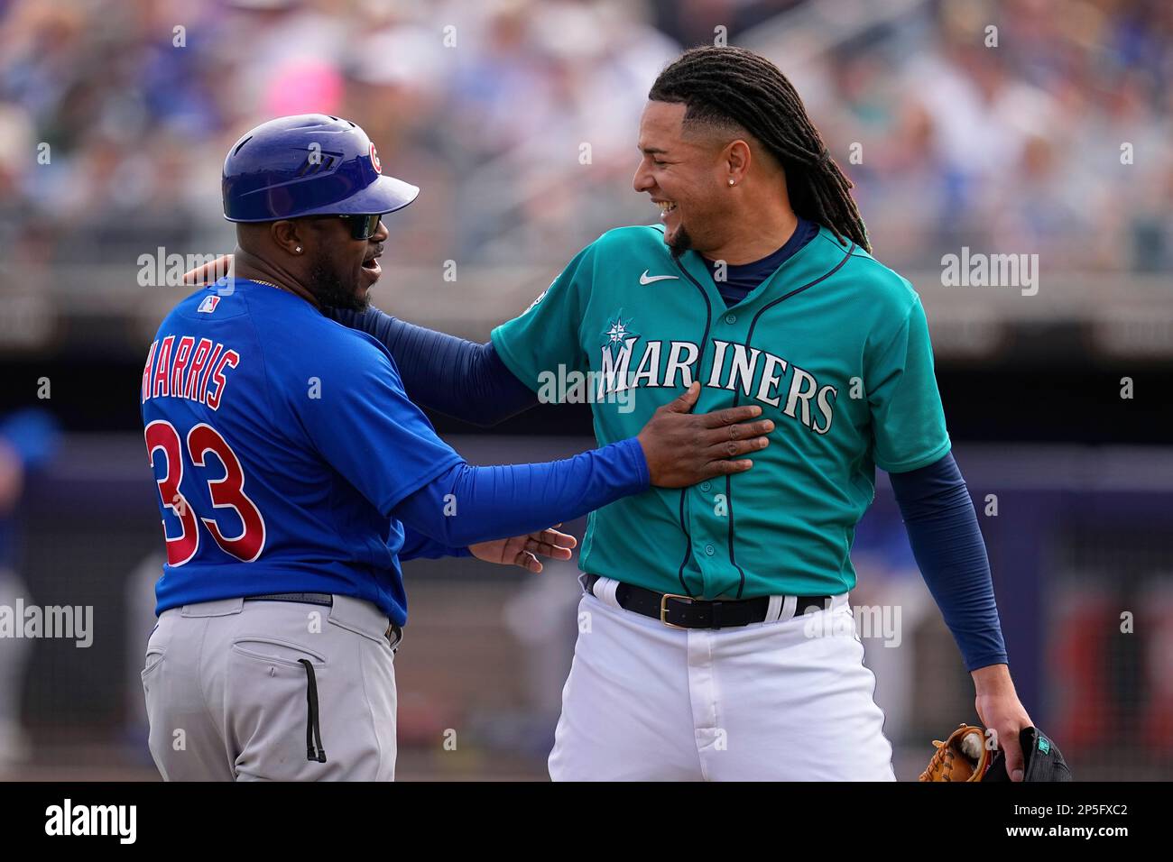 Chicago Cubs third base coach Willie Harris and Seattle Mariners