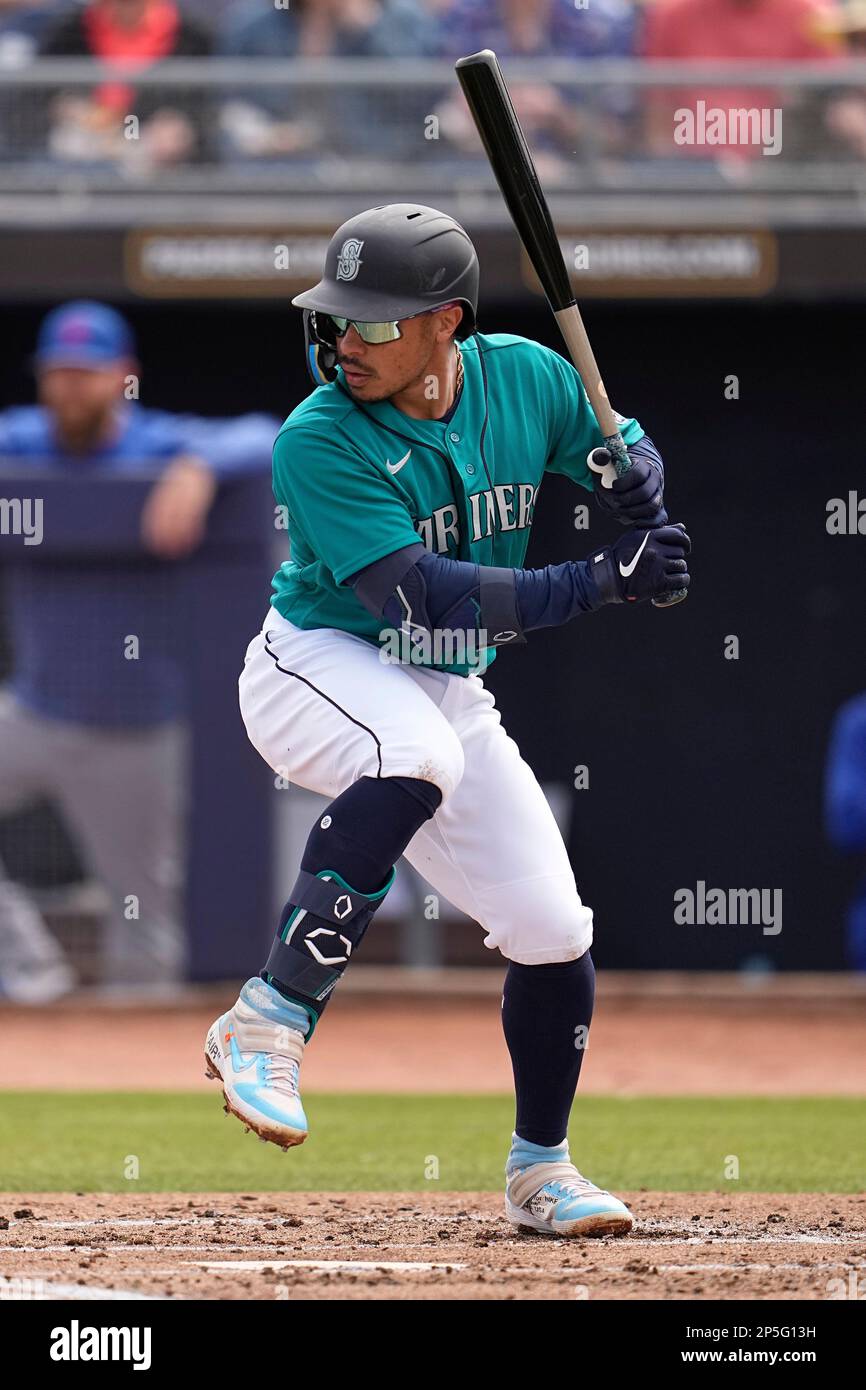 Seattle Mariners' Kolten Wong bats during the second inning of a spring