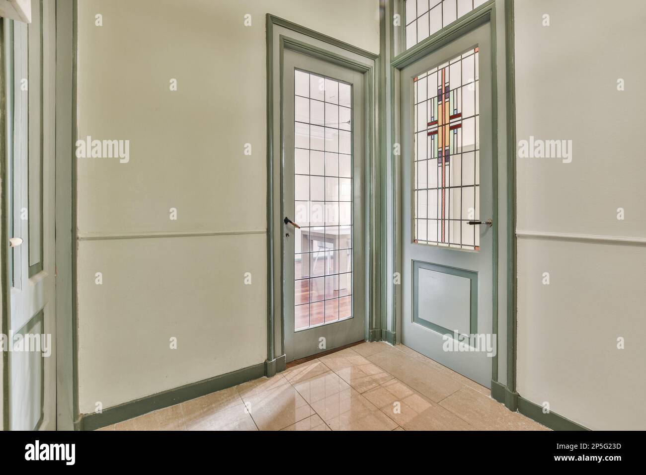the inside of a house with two doors and one door open to reveal