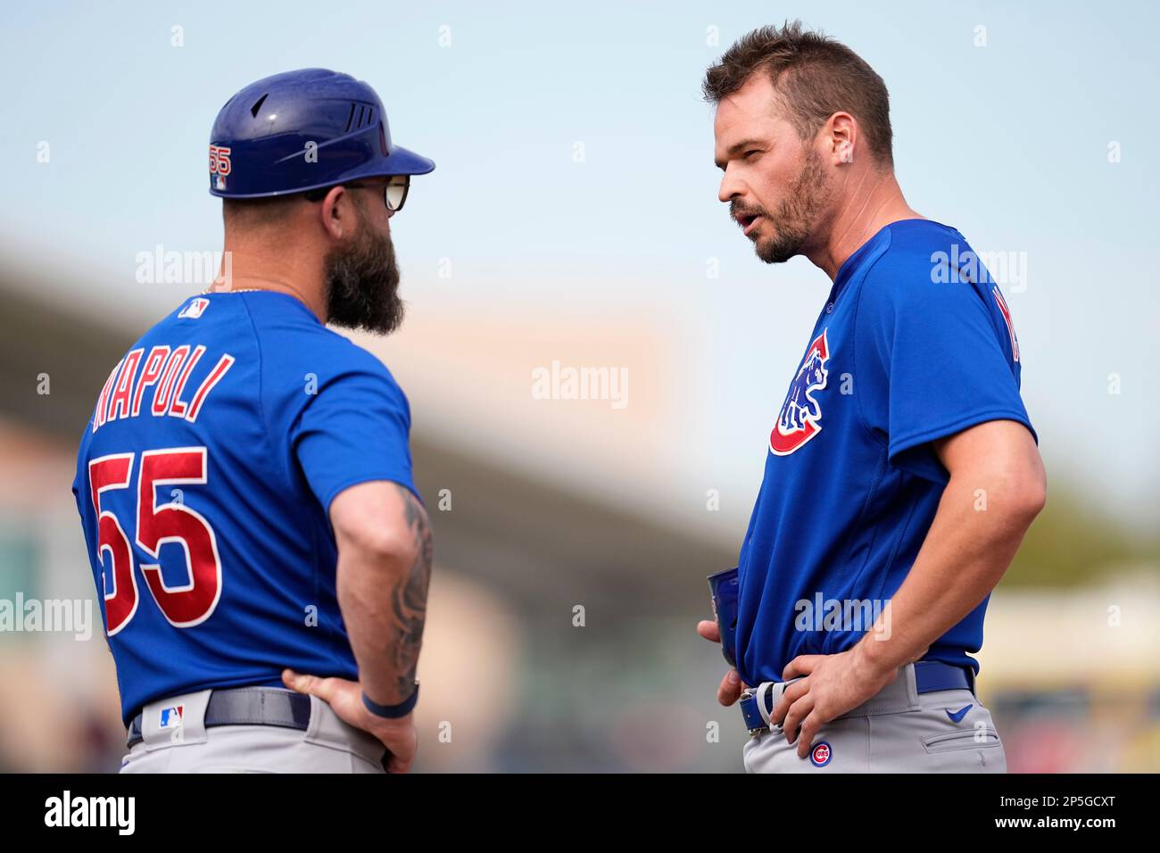 Chicago Cubs first base coach Mike Napoli (55), left, and Trey Mancini