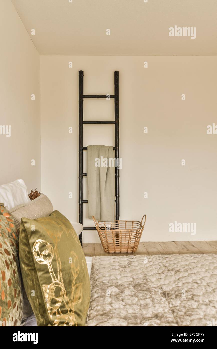 a bed in a room with a mirror on the wall above it and a chair at the